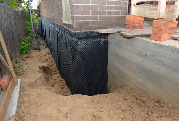 SJ Waterproofing Pros technician performing targeted Waterproofing assessment in Millburn, NJ